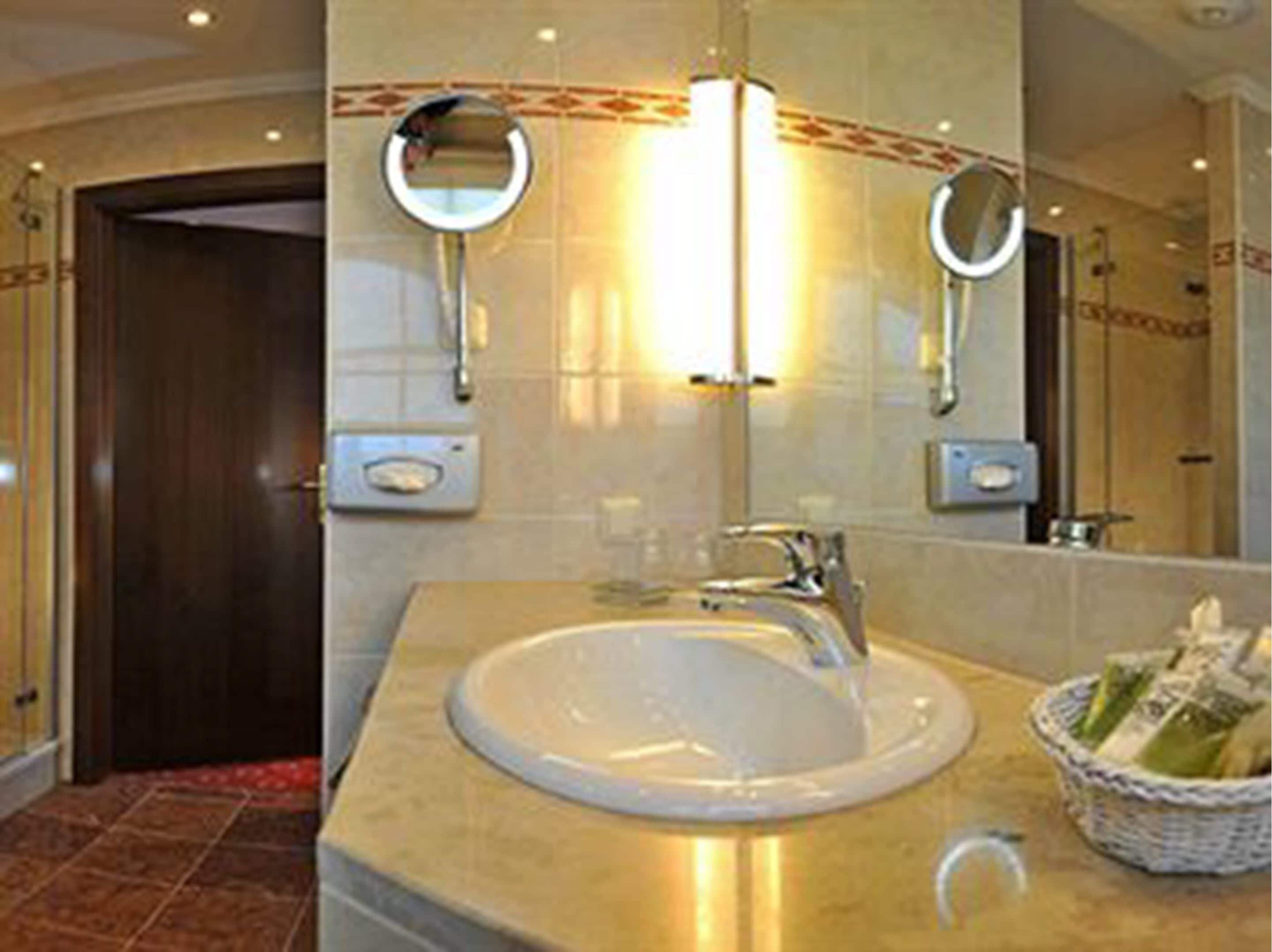 hair dryer, bathrobes, slippers, towels