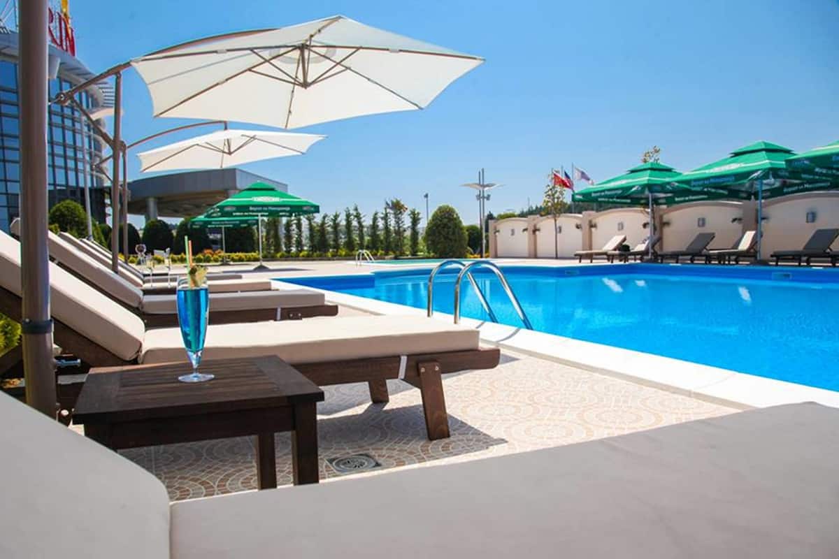 indoor pool, 2 outdoor pools, pool umbrellas, pool loungers