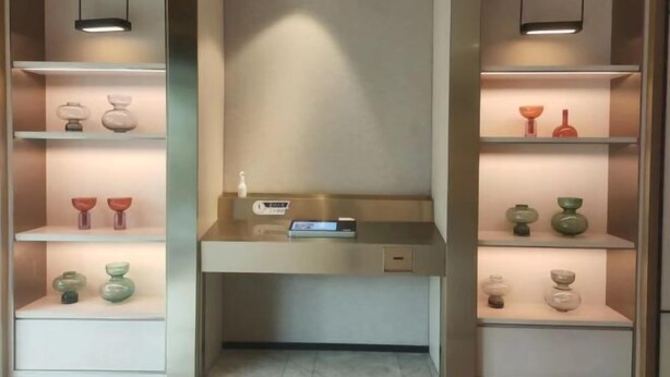 A modern bathroom with a central sink, shelves with decorative items, and pendant lights. - Orange Hotel Shanghai Longbai New Village Subway Station (Shanghai)