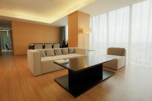 Suite, 1 King Bed, Balcony | Living area | 40-inch flat-screen TV with cable channels, TV