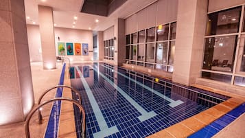 Indoor pool, open 9:00 AM to 6:00 PM, pool loungers