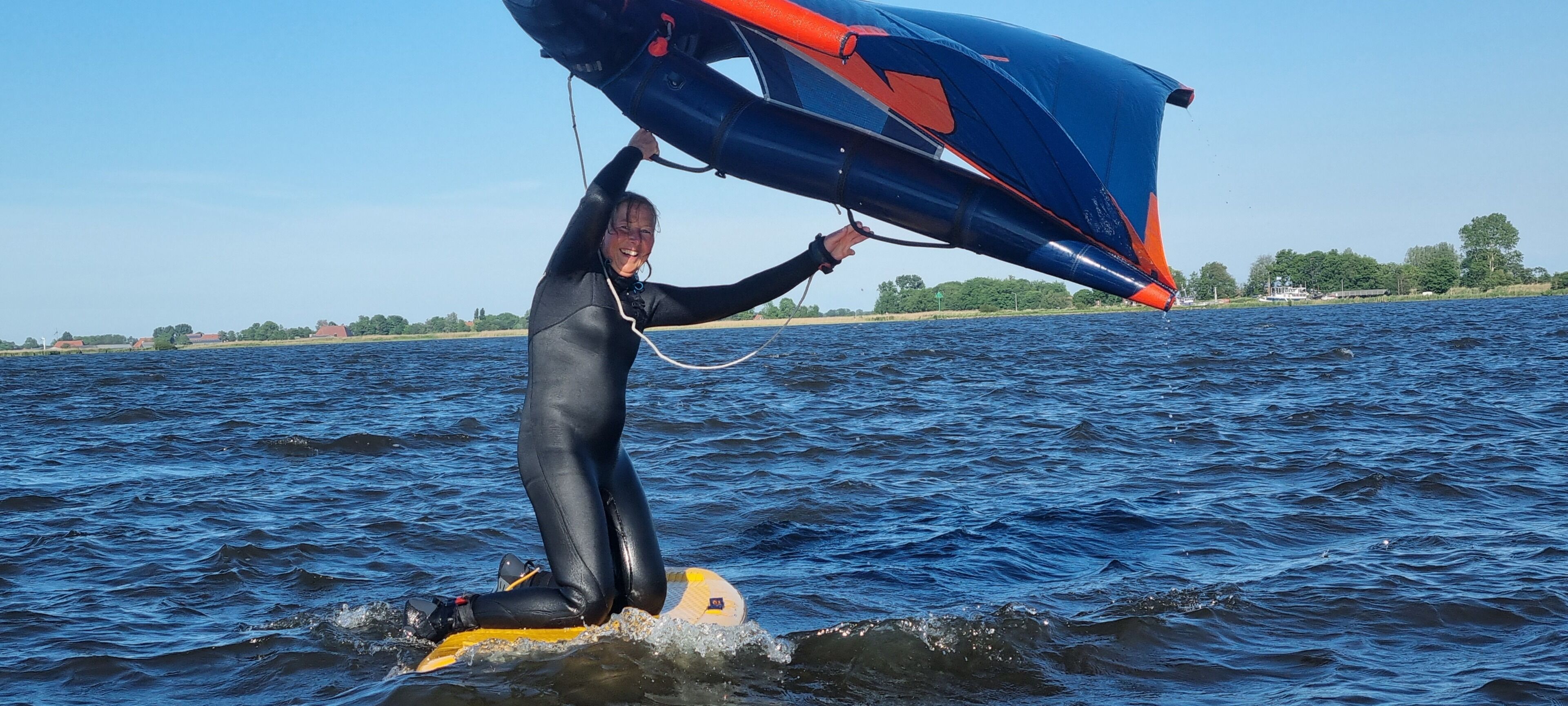 A person on a surfboard in a body of water.