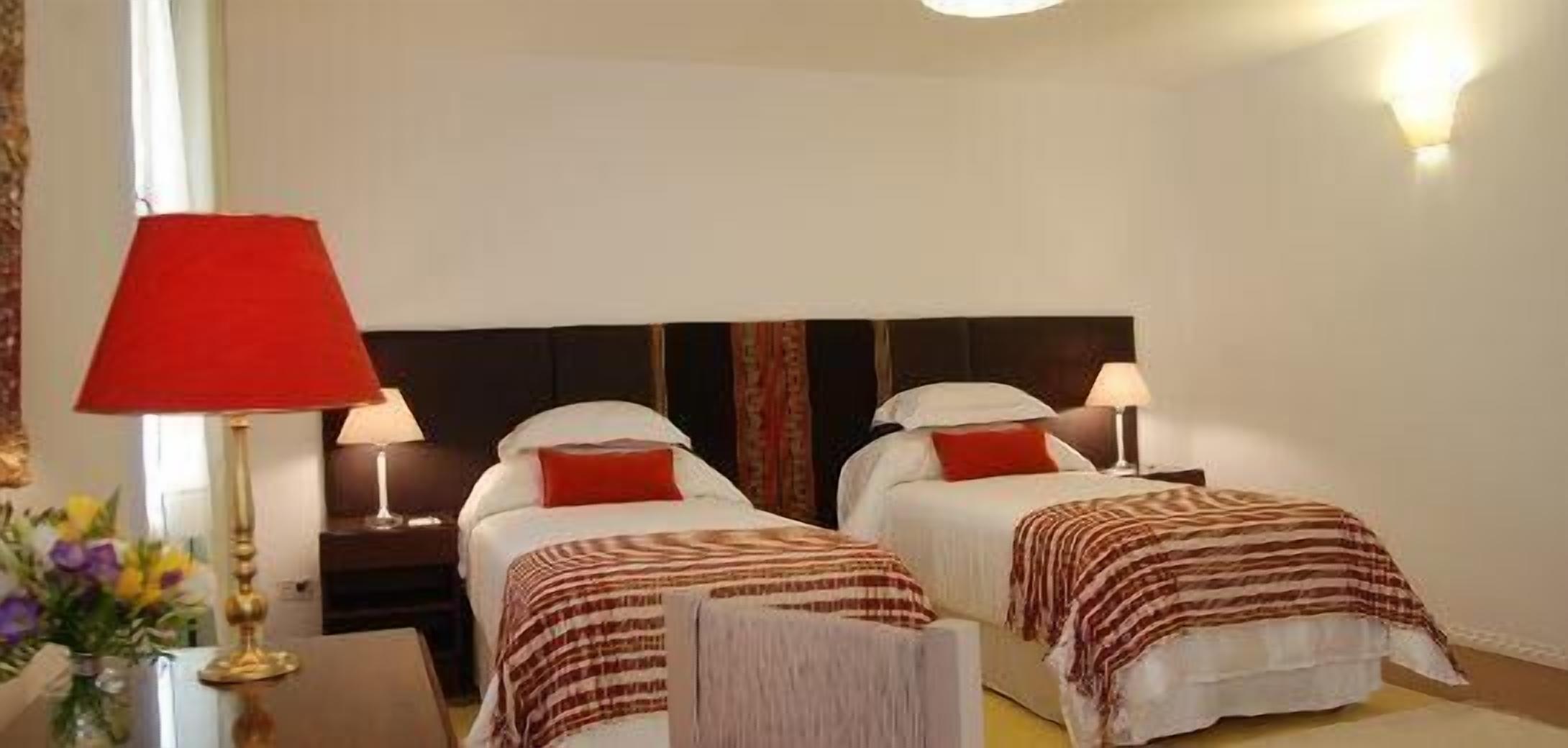 deluxe double or twin room | minibar, in-room safe, desk, iron/ironing board