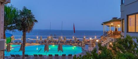 Indoor pool, outdoor pool, pool umbrellas