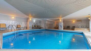 Indoor pool, outdoor pool, pool umbrellas