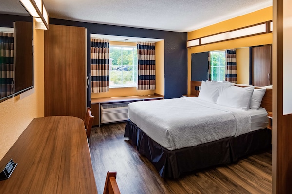 Hypo-allergenic bedding, pillowtop beds, desk, laptop workspace