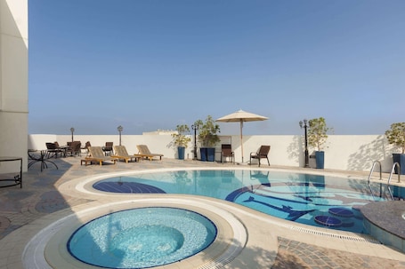 Outdoor pool, pool umbrellas, sun loungers