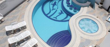 Outdoor pool, pool umbrellas, sun loungers