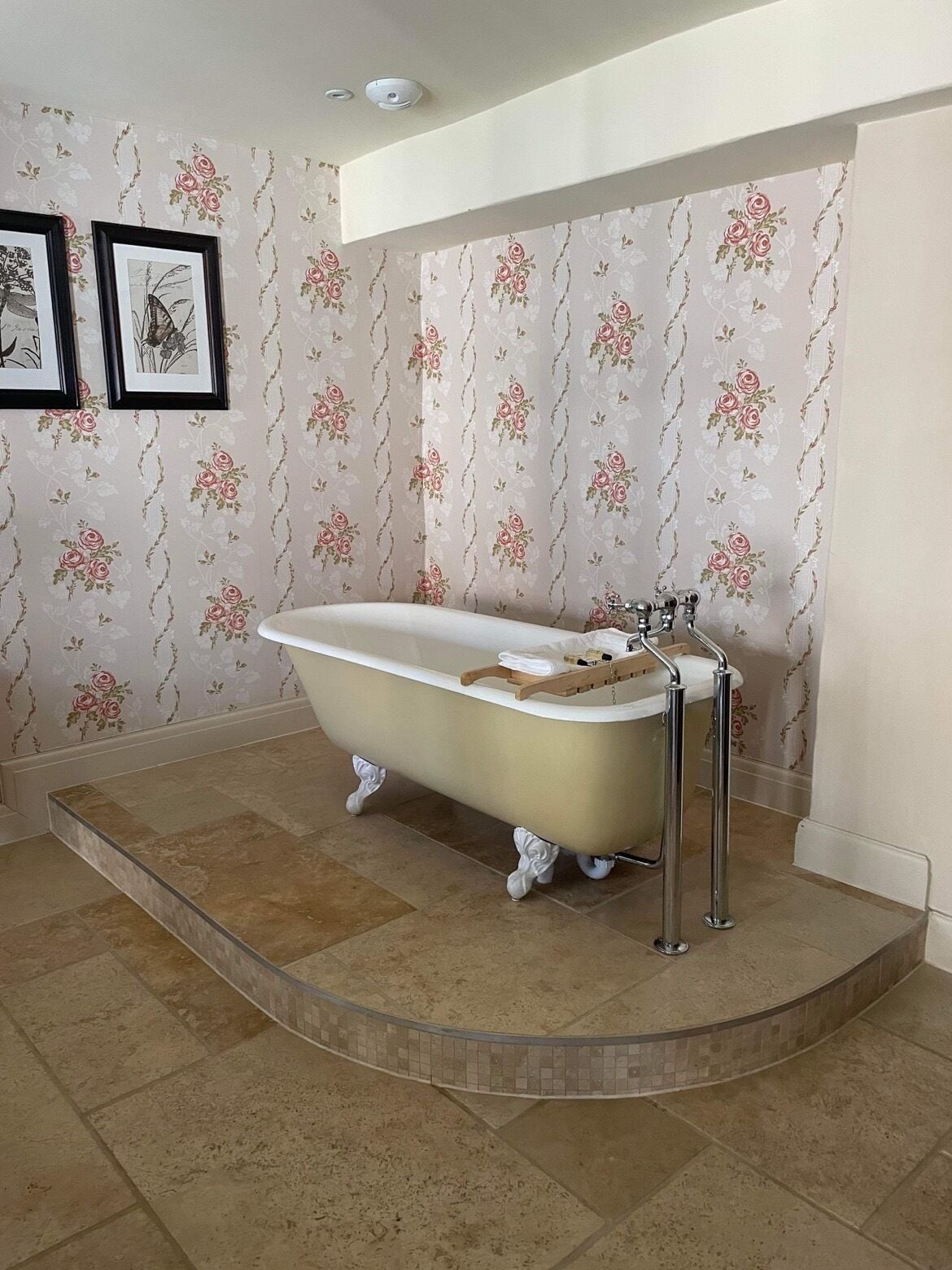 A bathroom with a freestanding bathtub, a shower, and a toilet.