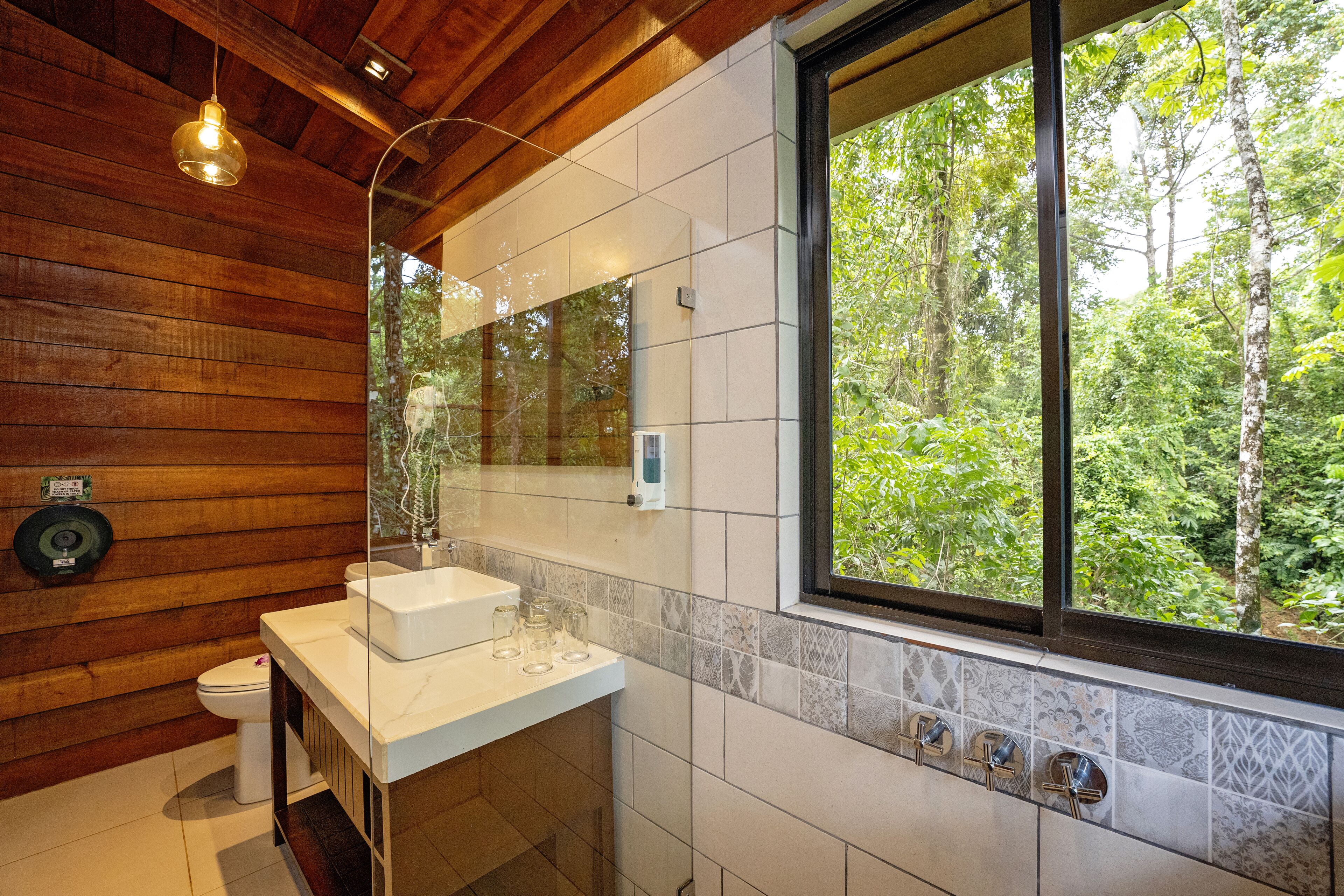 family tree house, mountain view | bathroom | shower, rainfall showerhead, eco-friendly toiletries, towels