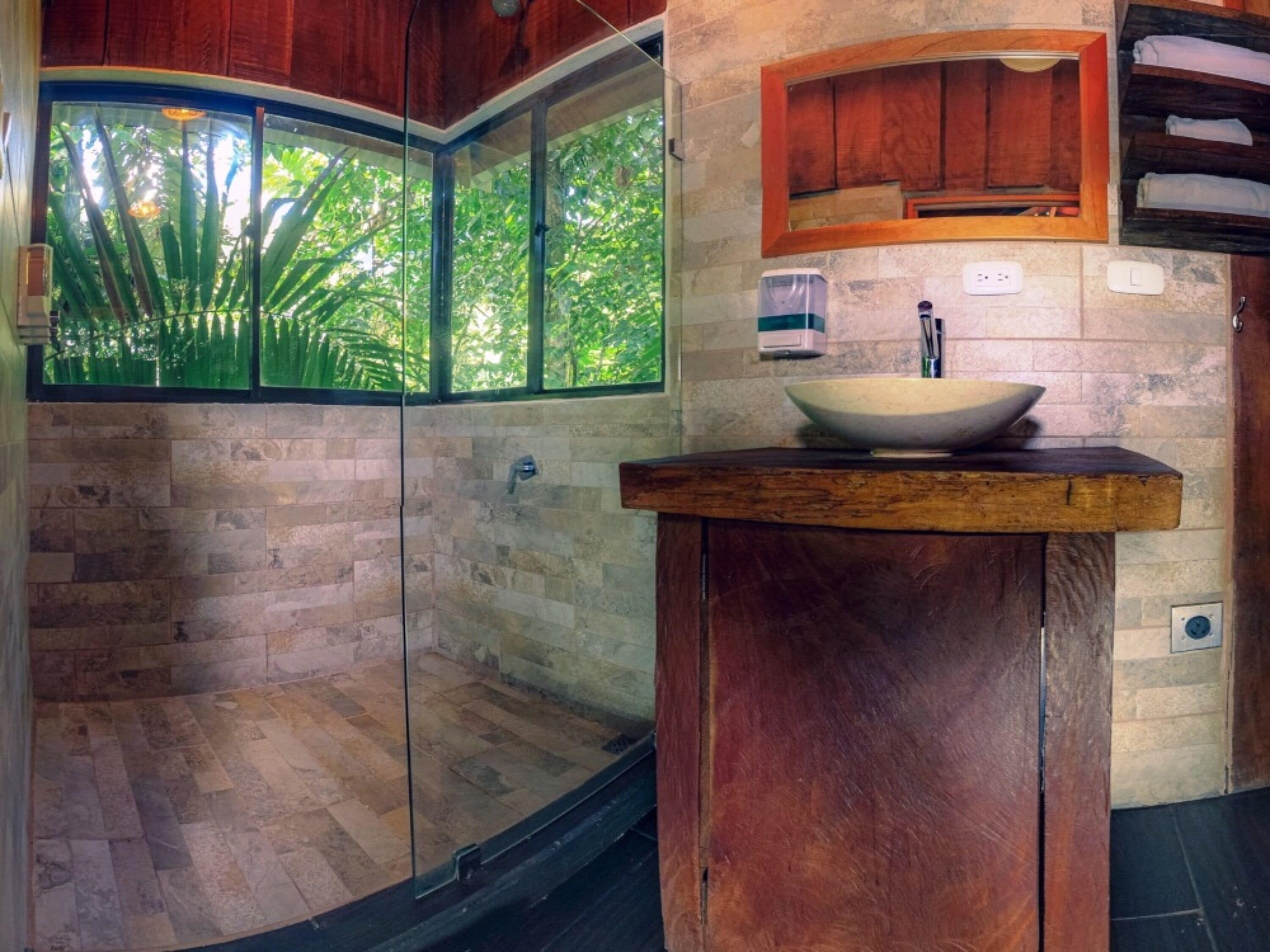 tree house, 1 king bed, mountain view | bathroom | shower, rainfall showerhead, eco-friendly toiletries, towels