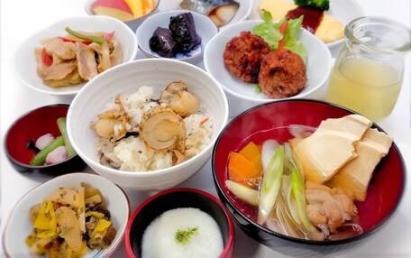A variety of dishes including rice, tofu, and vegetables, suggesting a meal setting.