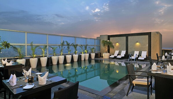 Outdoor pool, pool umbrellas, pool loungers