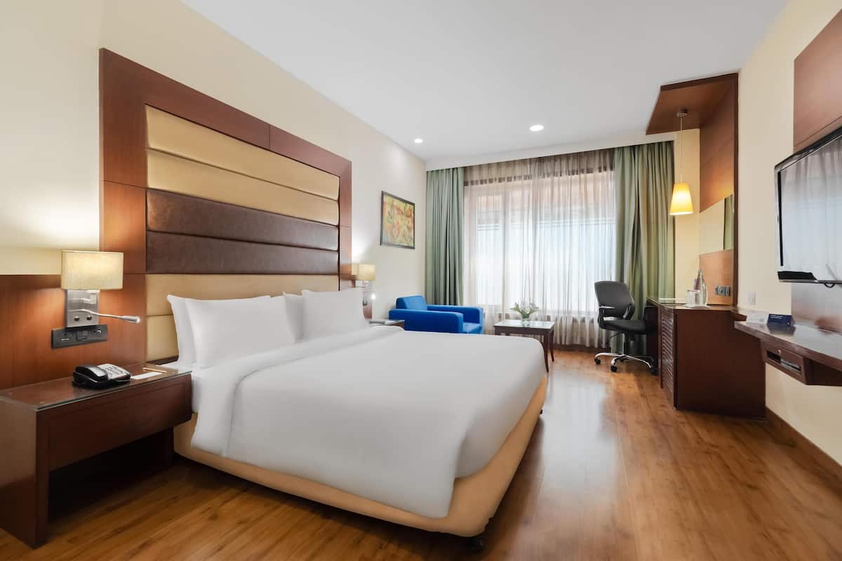 Hypo-allergenic bedding, free minibar items, in-room safe, desk