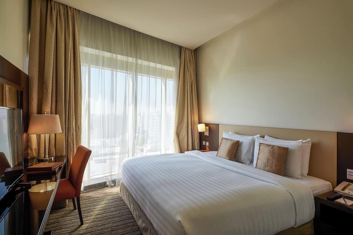 deluxe single room | egyptian cotton sheets, pillow-top beds, minibar, in-room safe