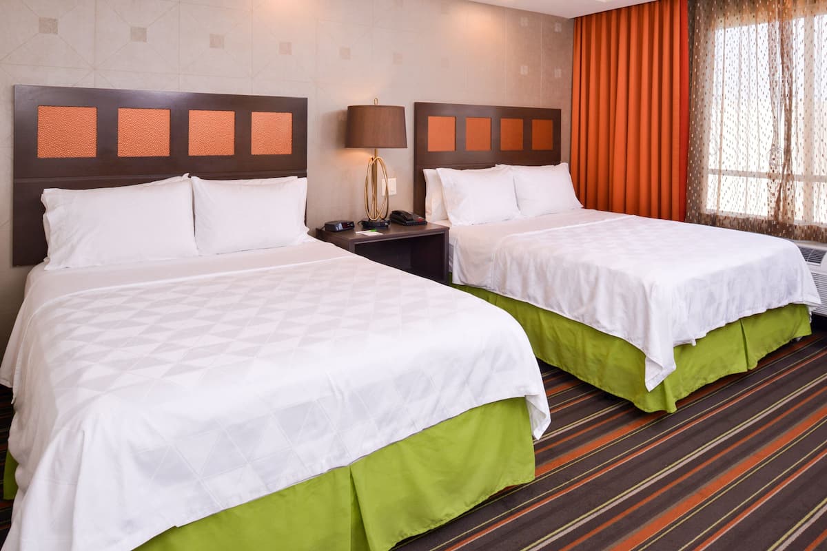 Pillow-top beds, desk, blackout curtains, iron/ironing board