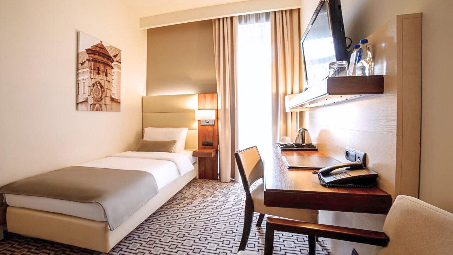 Økonomi-enkeltrom, 1 enkeltseng | Sengetøy av topp kvalitet, safe på rommet og skrivebord