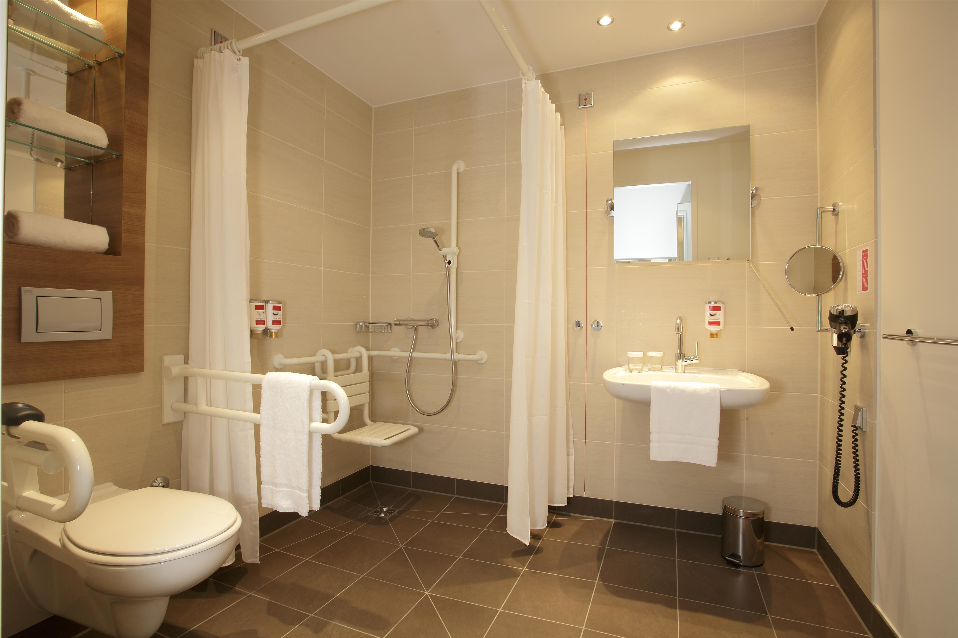 shower, rainfall showerhead, hair dryer, towels