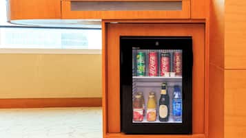 A minibar with beverages and snacks.