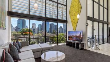 1 Bedroom Loft Penthouse | Living area | Flat-screen TV, DVD player