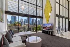 1 Bedroom Loft Penthouse | Living area | Flat-screen TV, DVD player