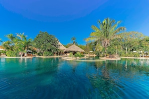 Outdoor pool, open 8:00 AM to 5:00 PM, pool umbrellas