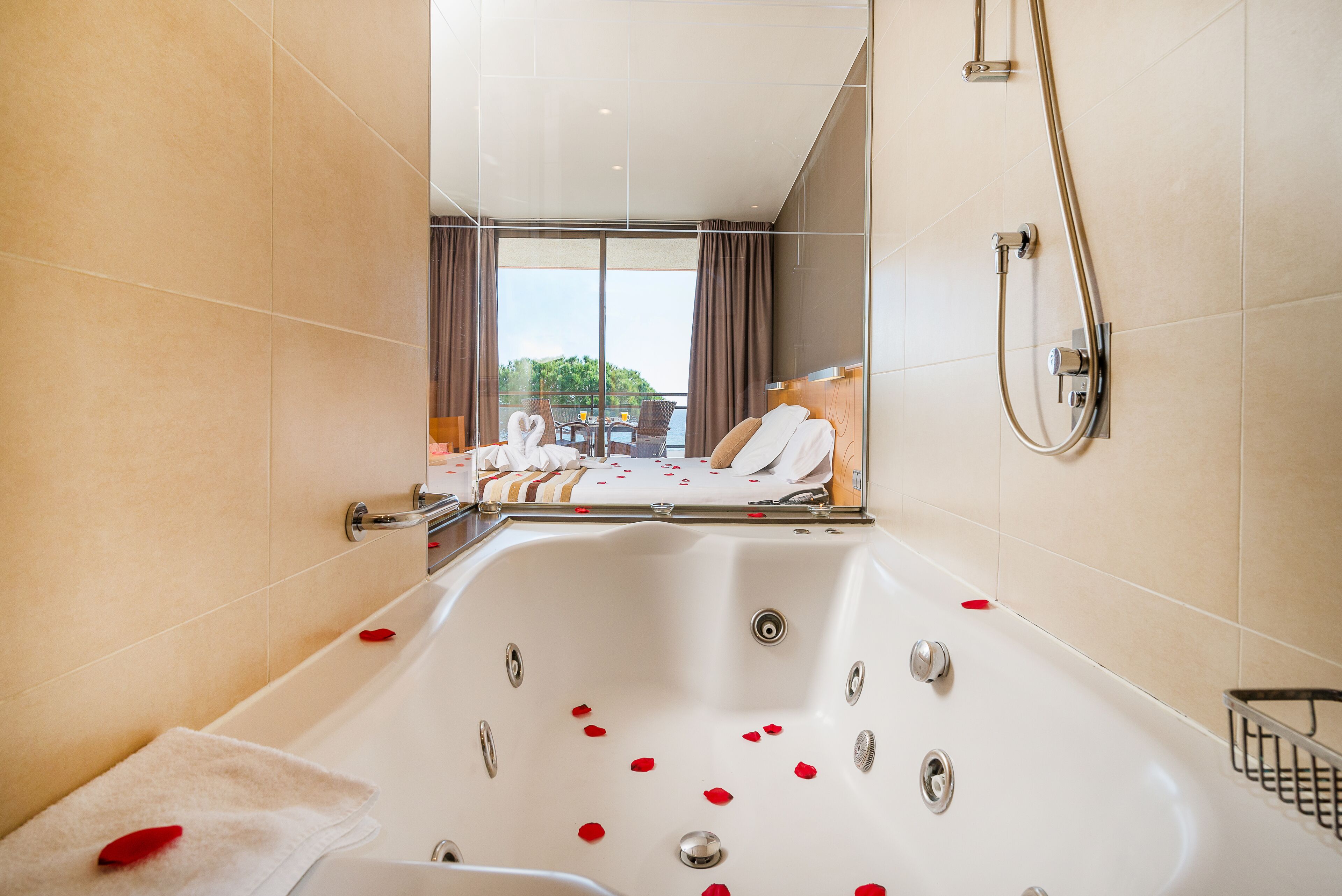 double room, jetted tub, sea view | bathroom | hair dryer, towels