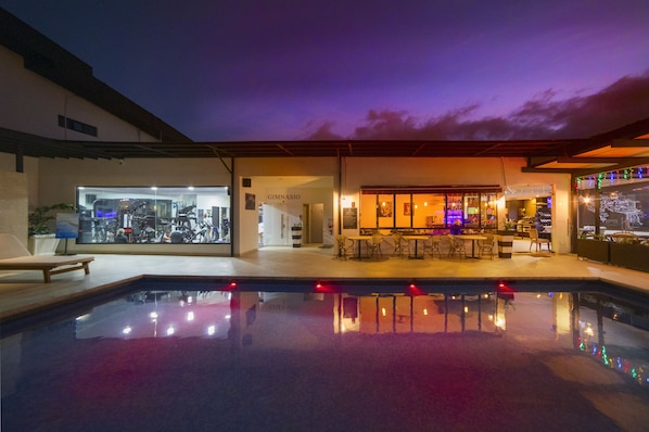 Outdoor pool, open 8:00 AM to 8:00 PM, pool loungers