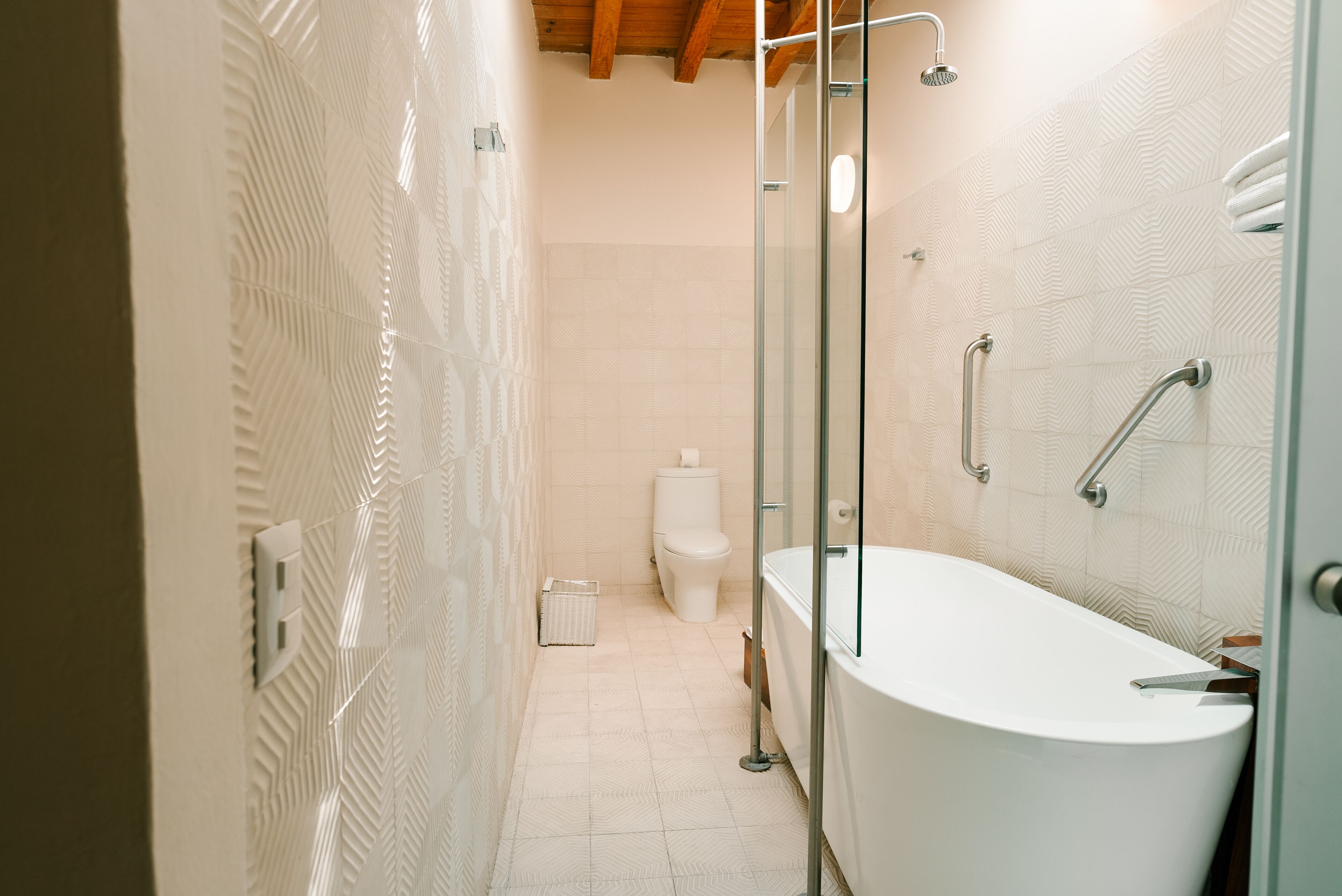 suite toledo | bathroom | designer toiletries, hair dryer, bathrobes, slippers