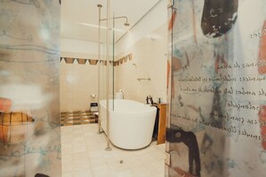Suite Leyva | Bathroom | Designer toiletries, hair dryer, bathrobes, slippers