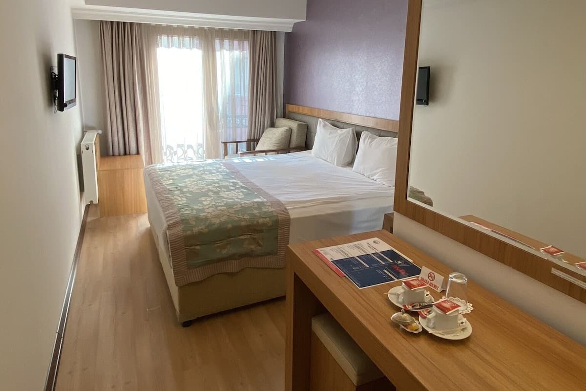 Standard Room | Living area | 22-inch LCD TV with satellite channels, TV