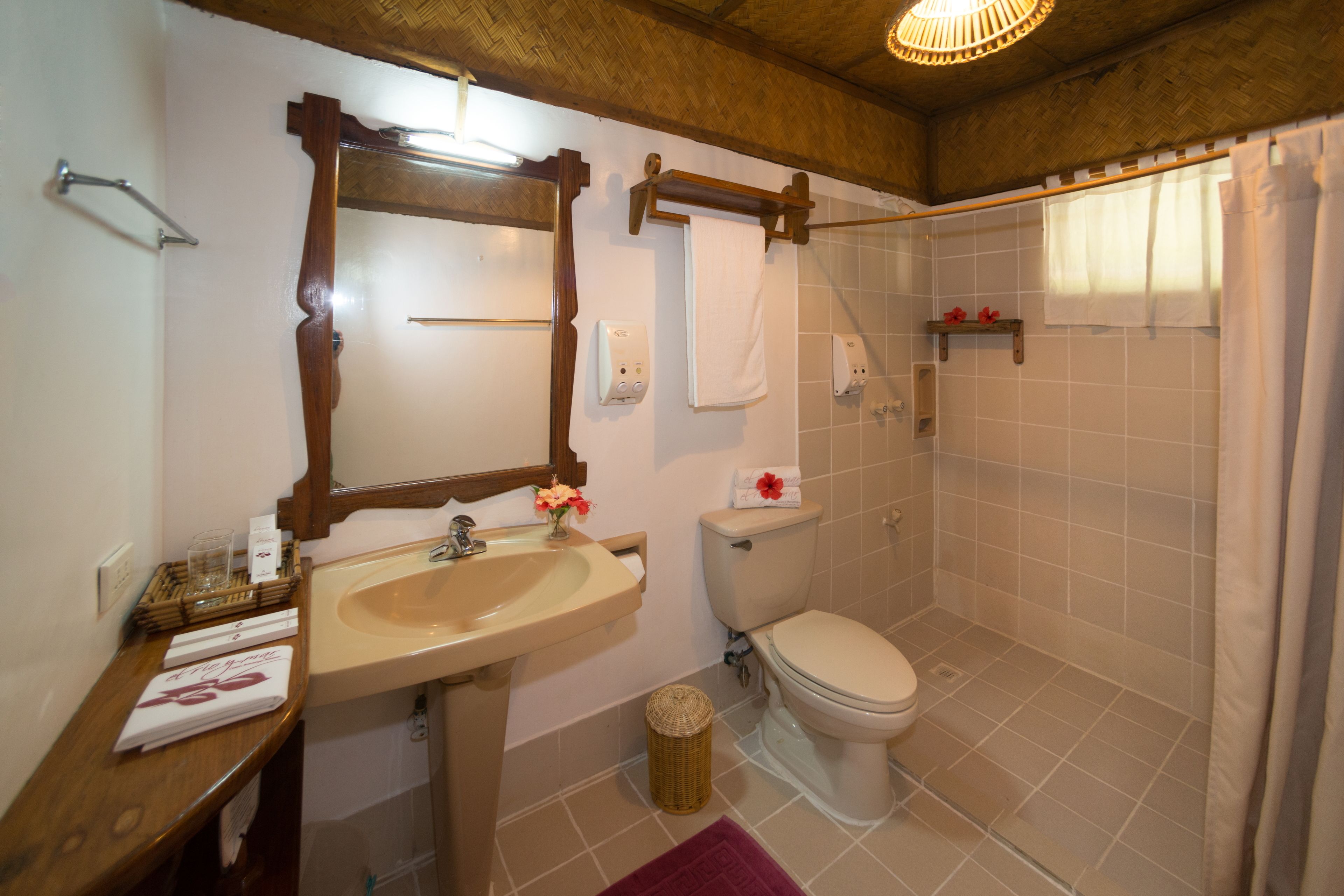 standard native cabana | bathroom | shower, rainfall showerhead, free toiletries, hair dryer