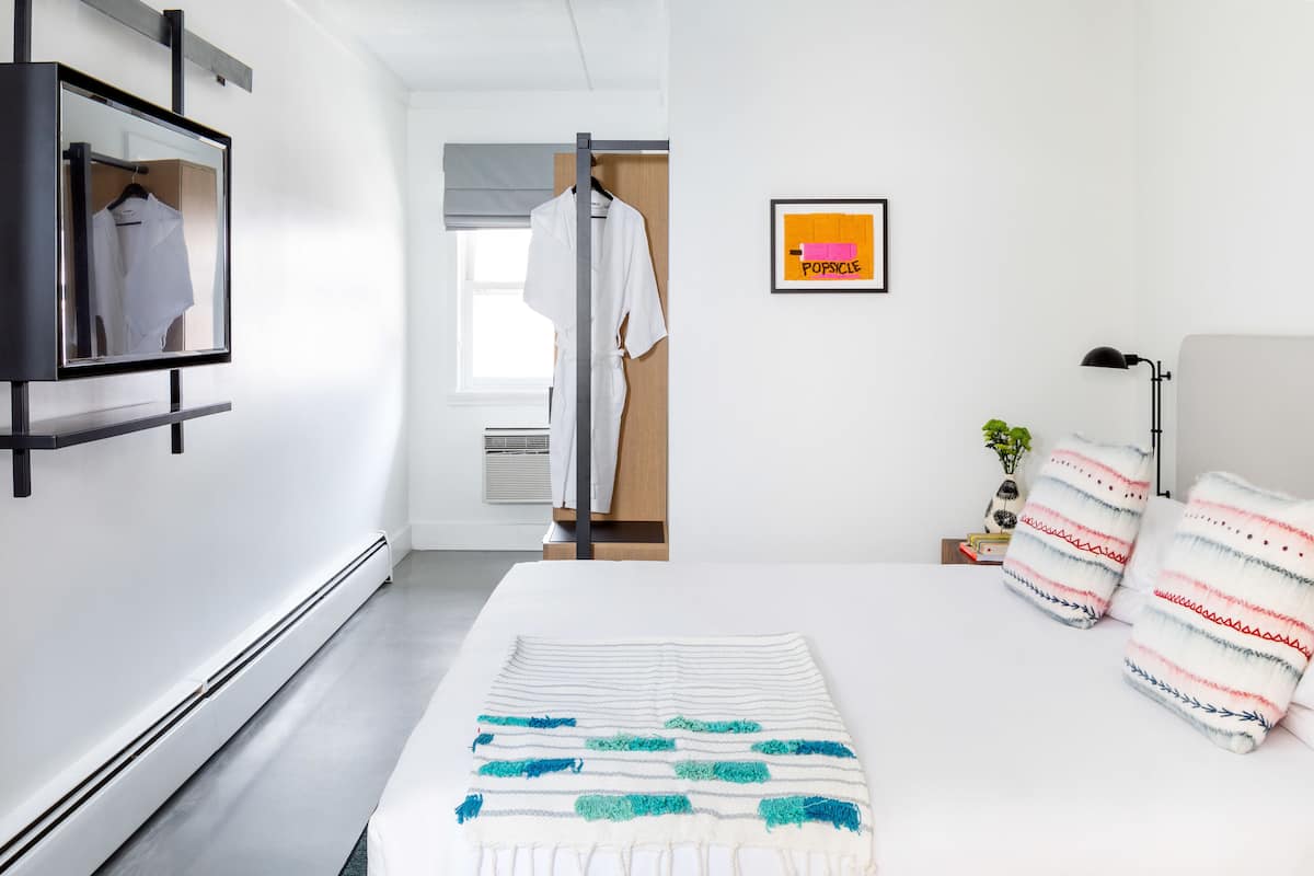 petite king | premium bedding, blackout curtains, iron/ironing board, free wifi