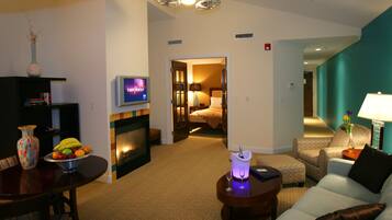 Premium Suite, 1 Queen Bed, Balcony (Fireplace) | Living area | 40-inch flat-screen TV with cable channels, TV, iPod dock