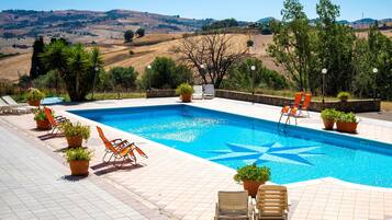 Seasonal outdoor pool, pool umbrellas, sun loungers