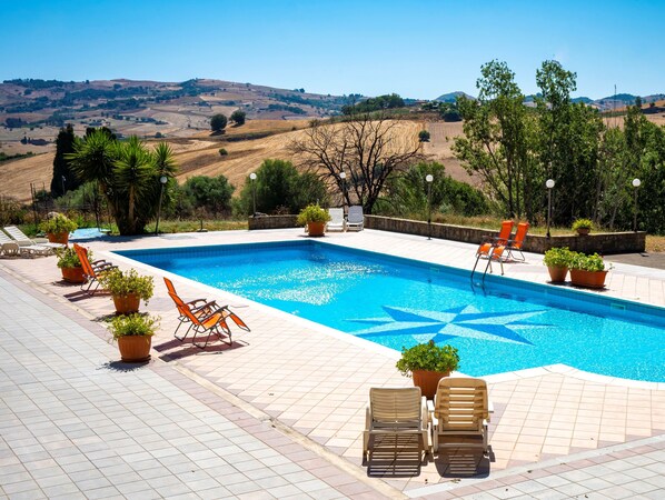 Seasonal outdoor pool, pool umbrellas, pool loungers