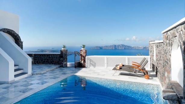 A clear blue sky with a view of the sea and distant mountains. - Vallas Apartments & Villas (Santorini)