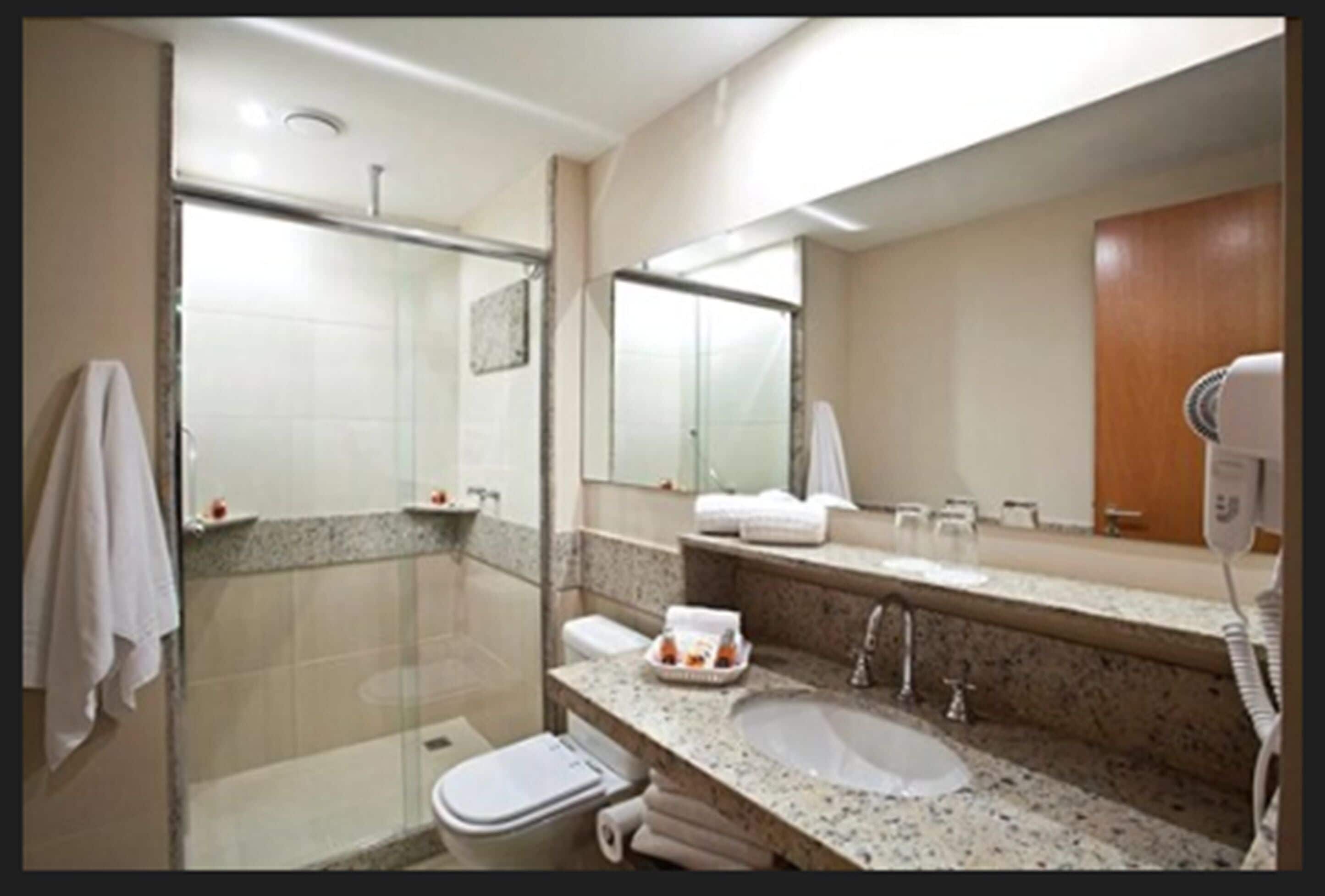 superior apartment | bathroom | shower, hair dryer, towels