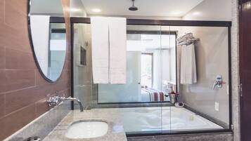 Suite Resort | Bathroom | Hair dryer, towels
