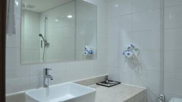 Combined shower/tub, hair dryer, bathrobes, slippers