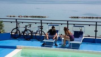 Seasonal outdoor pool, open 8:00 AM to 8 PM, pool loungers
