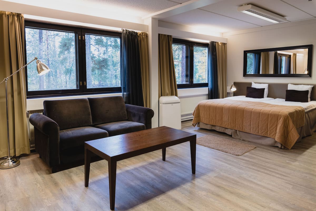 Premium bedding, desk, laptop workspace, blackout curtains