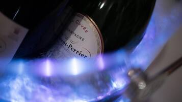 A bottle of champagne with a label that reads "Cuvée Champagne."