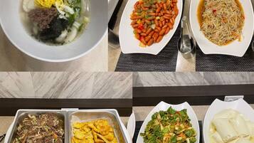A buffet with various dishes including soup, stir-fried vegetables, and salads.
