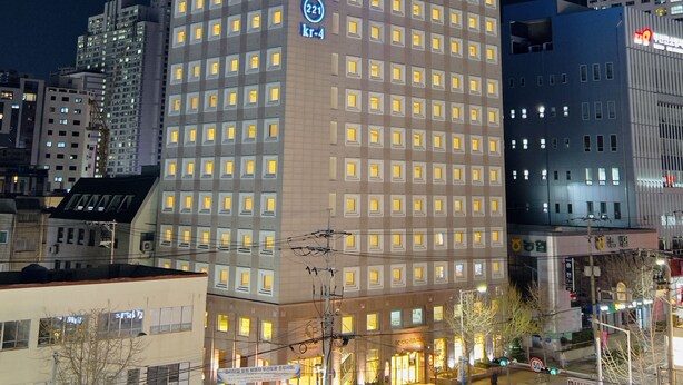 A multi-story hotel with a prominent sign displaying its name and website. - Toyoko Inn Busan Seo-myeon (Busan)