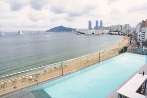Seasonal outdoor pool, open 9:00 AM to 9:00 PM, pool loungers
