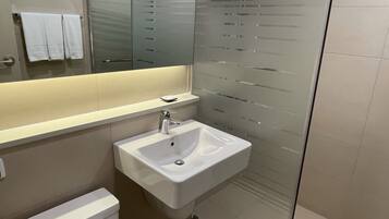 Shower, rainfall showerhead, hair dryer, towels