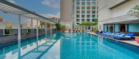 Outdoor pool, open 6:00 AM to 8:00 PM, pool loungers, lifeguards on site