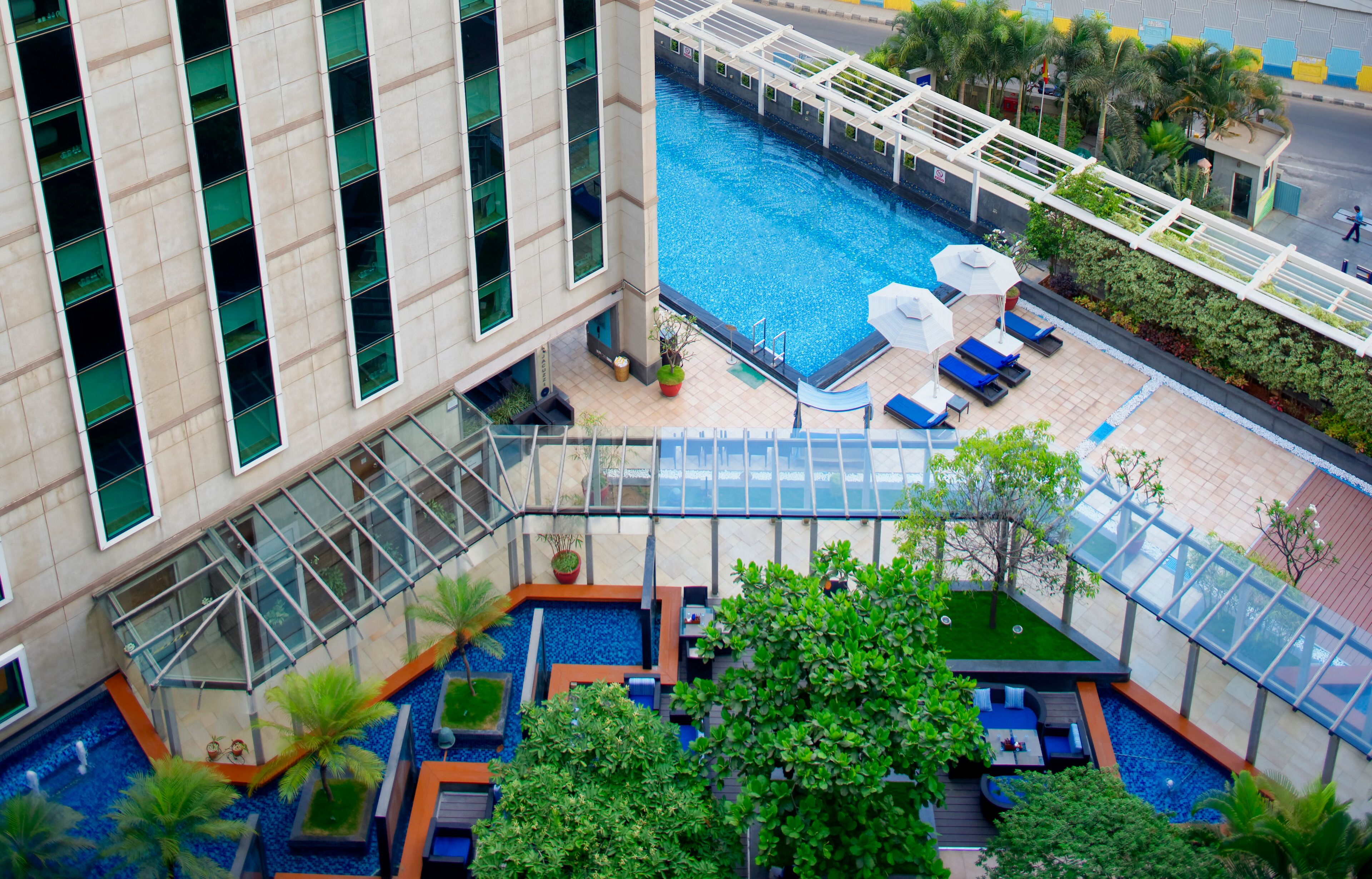 outdoor pool, open 6:00 am to 8:00 pm, pool loungers, lifeguards on site