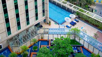 Outdoor pool, open 6:00 AM to 8:00 PM, sun loungers, lifeguards on site